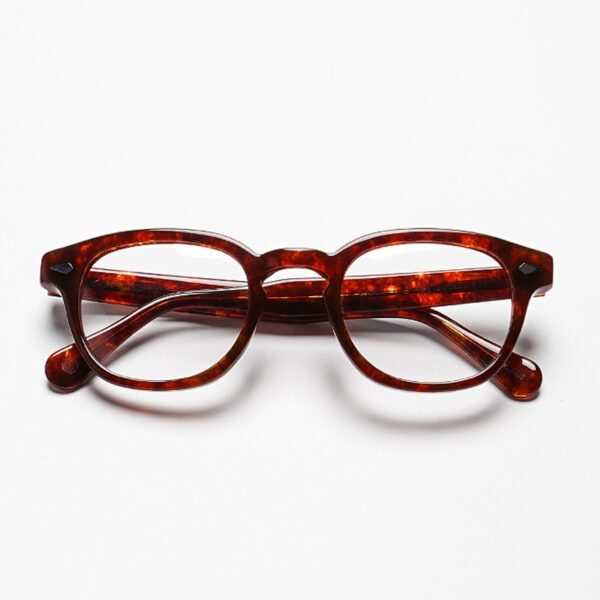 Handcrafted with a compact silhouette and bold acetate